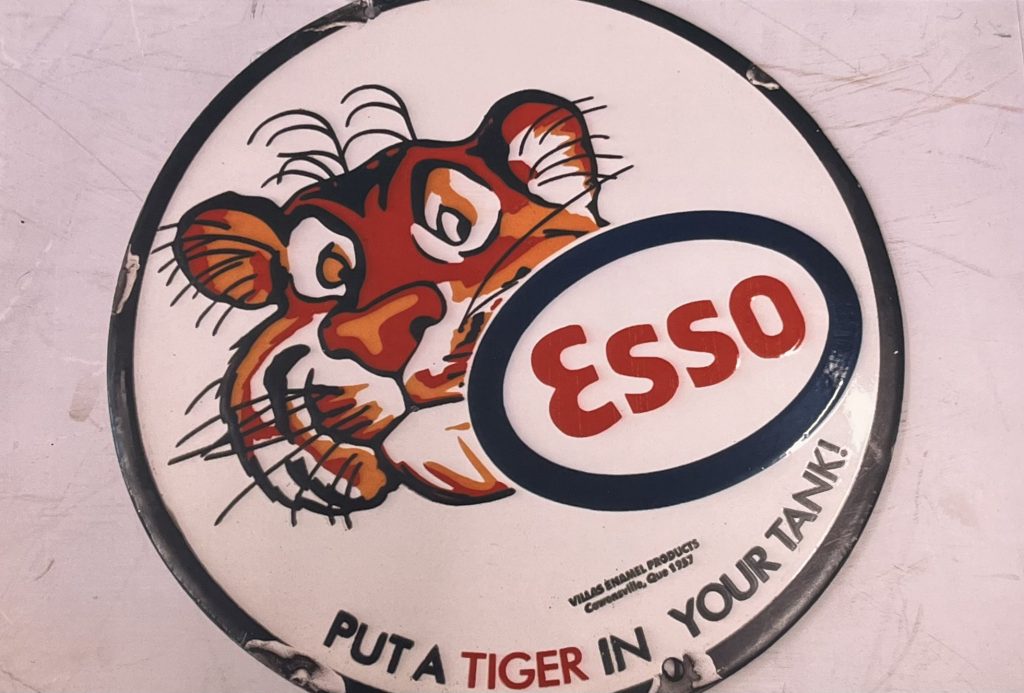 Put A Tiger In Your Tank enamel sign