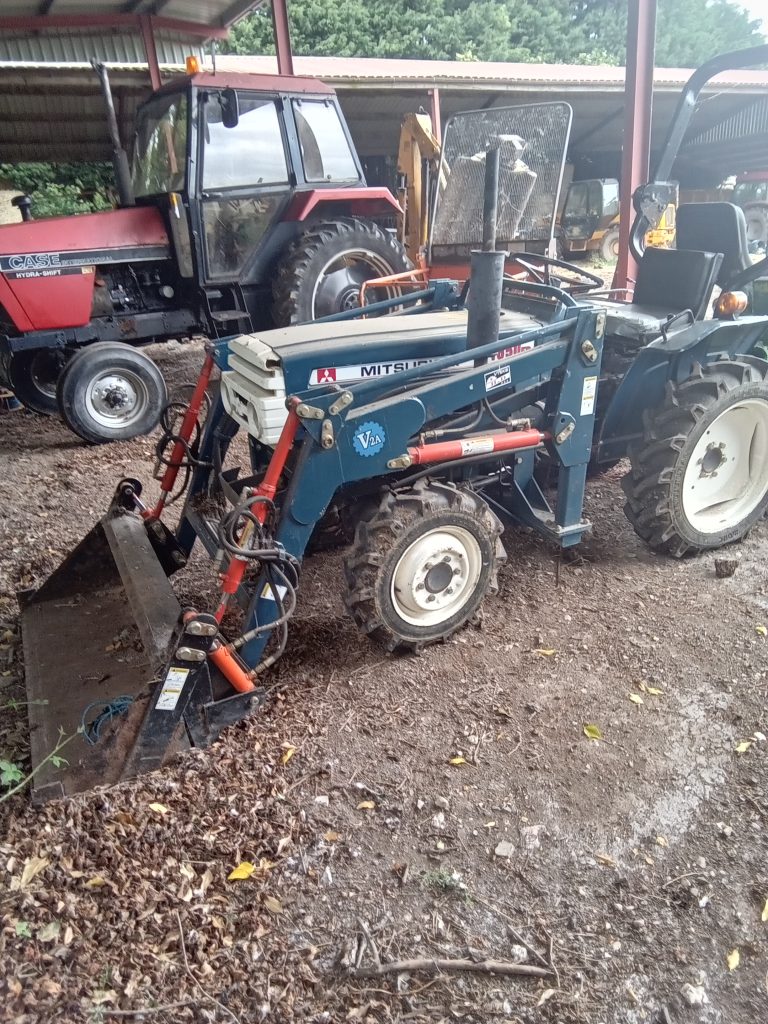 Mitsubishi compact tractor with front end loader and rear end backactor