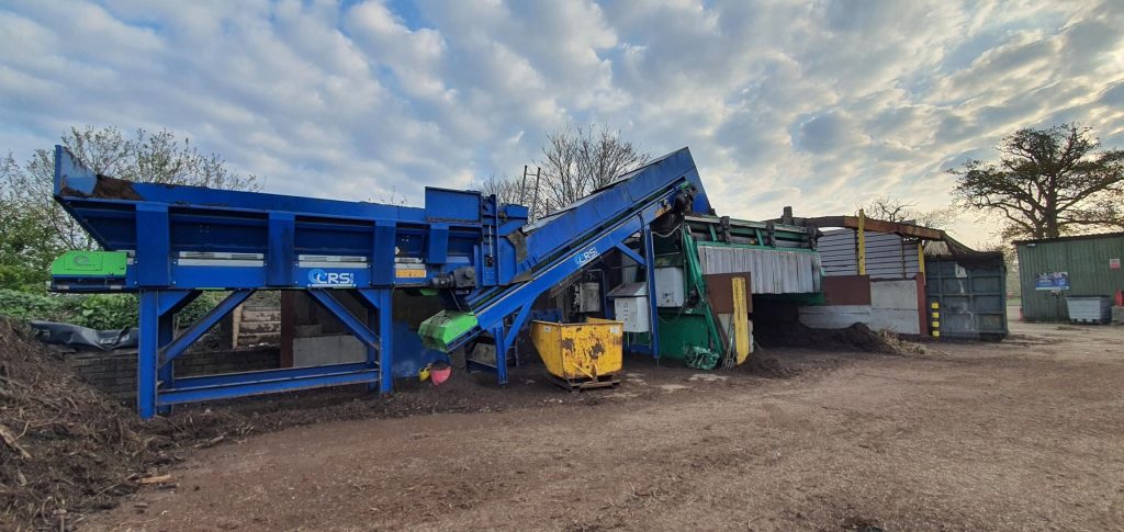Komptech Semi-mobile 2-fraction screening system with CRS NI Ltd hopper and feed conveyor