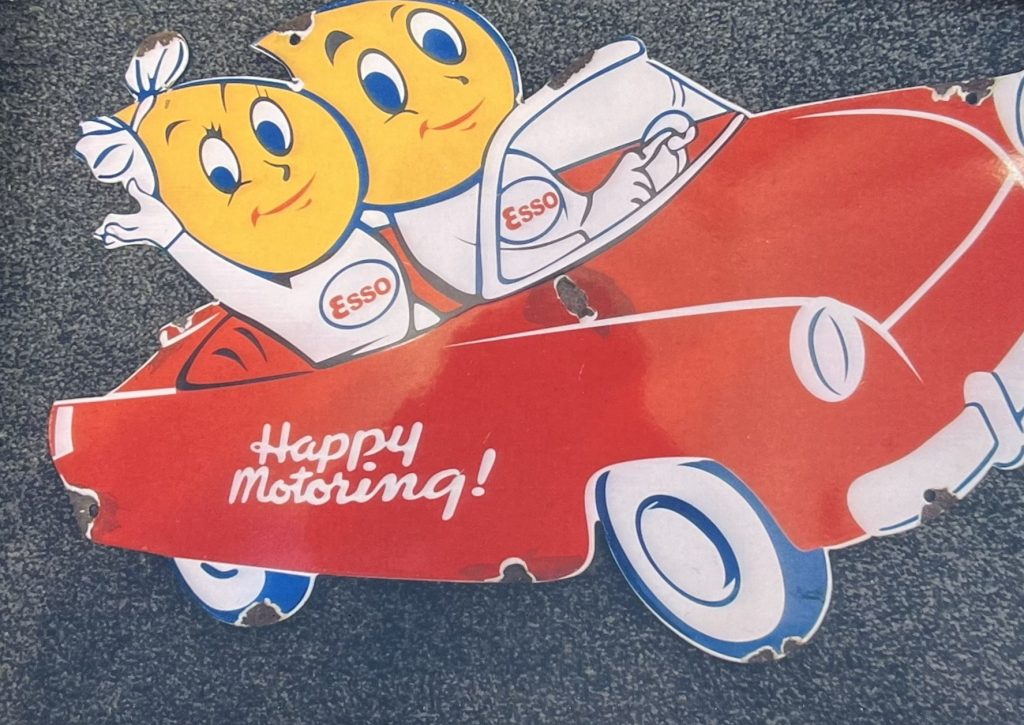 Esso Sign Esso Oil Drip Lady and Man Happy Motoring Enamel Sign